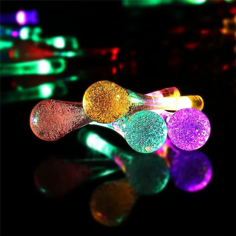 Solar-powered LED outdoor string lights with bubble drop pendants on 6.5 metre cable
