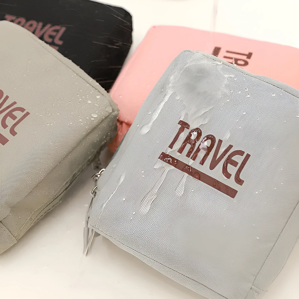 Black cube-shaped travel storage bag made from Oxford cloth with a sealed top.