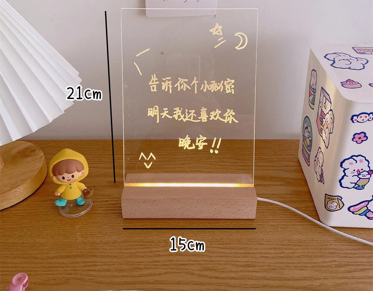 LED bedside lamp with erasable message board available in seven design options including candle simulation and bear shapes