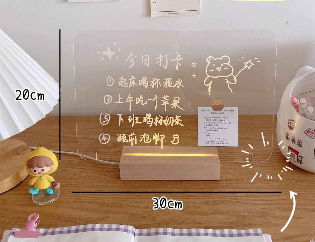 LED bedside lamp with erasable message board available in seven design options including candle simulation and bear shapes