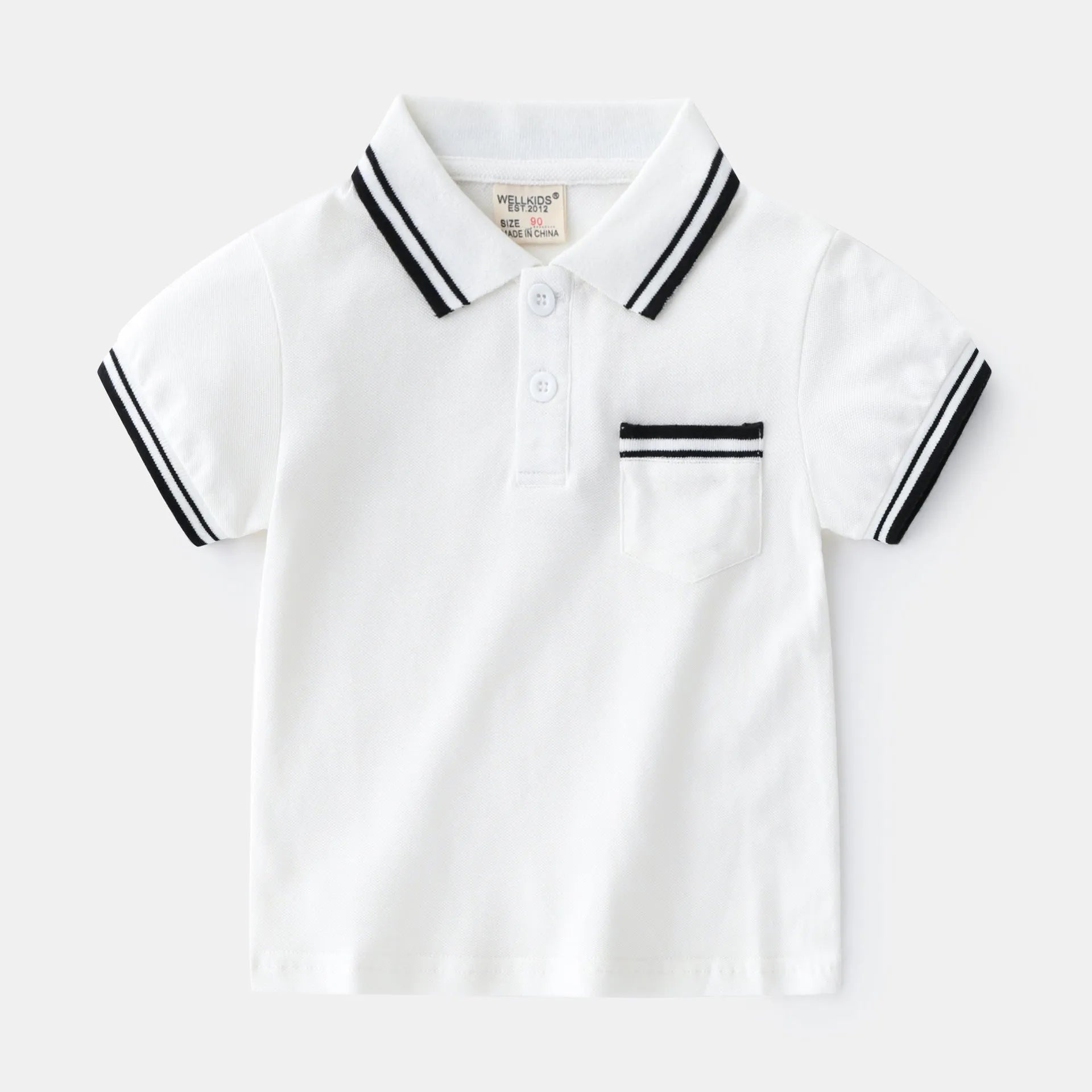 White boys cotton polo shirt with short sleeves and a round neck on a flat lay.