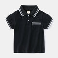 White boys cotton polo shirt with short sleeves and a round neck on a flat lay.