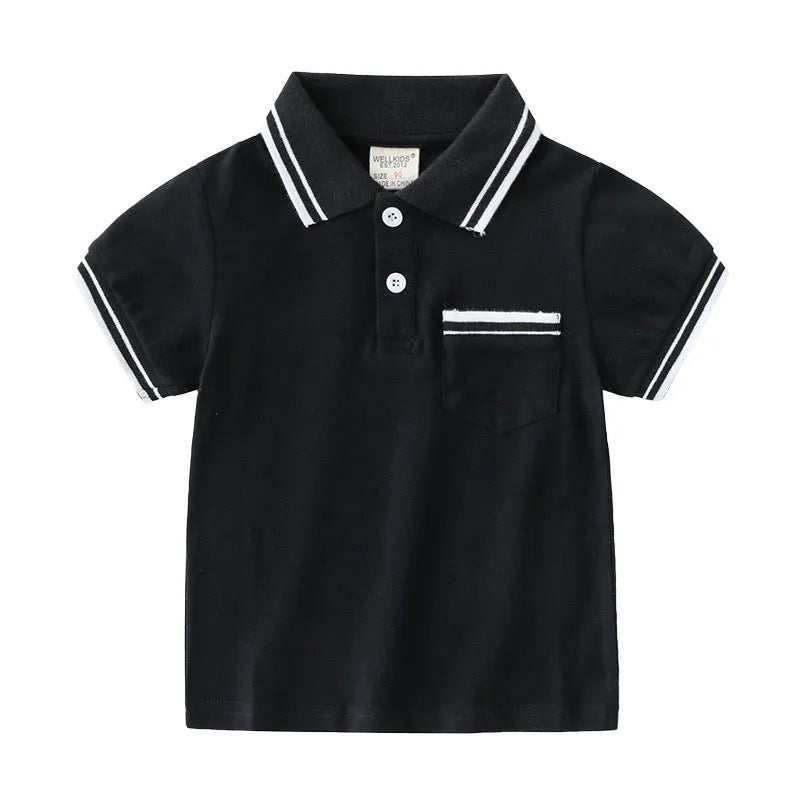 White boys cotton polo shirt with short sleeves and a round neck on a flat lay.