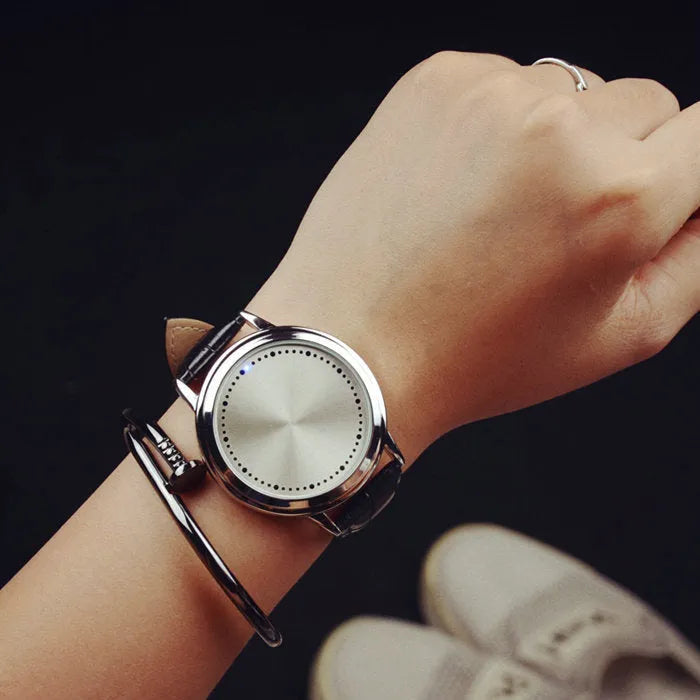 Electronic digital watch with blue LED display and plastic case on wrist