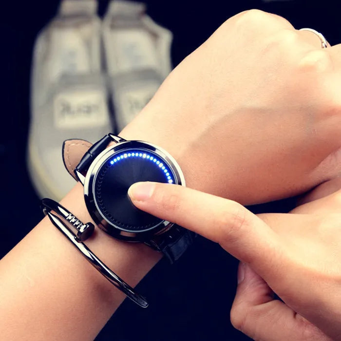 Electronic digital watch with blue LED display and plastic case on wrist