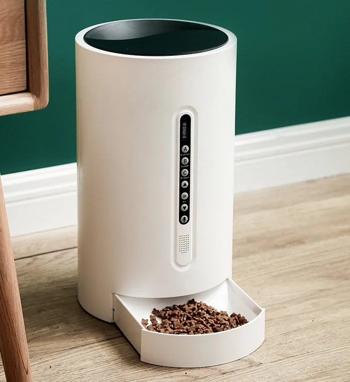 White smart pet feeder with 4.6L granary and timed dispensing on a countertop