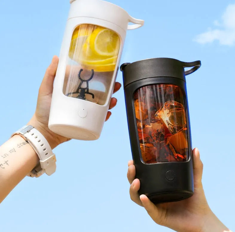Portable automatic juice blender in black, blue, pink, or white colours showing 650ml capacity markings