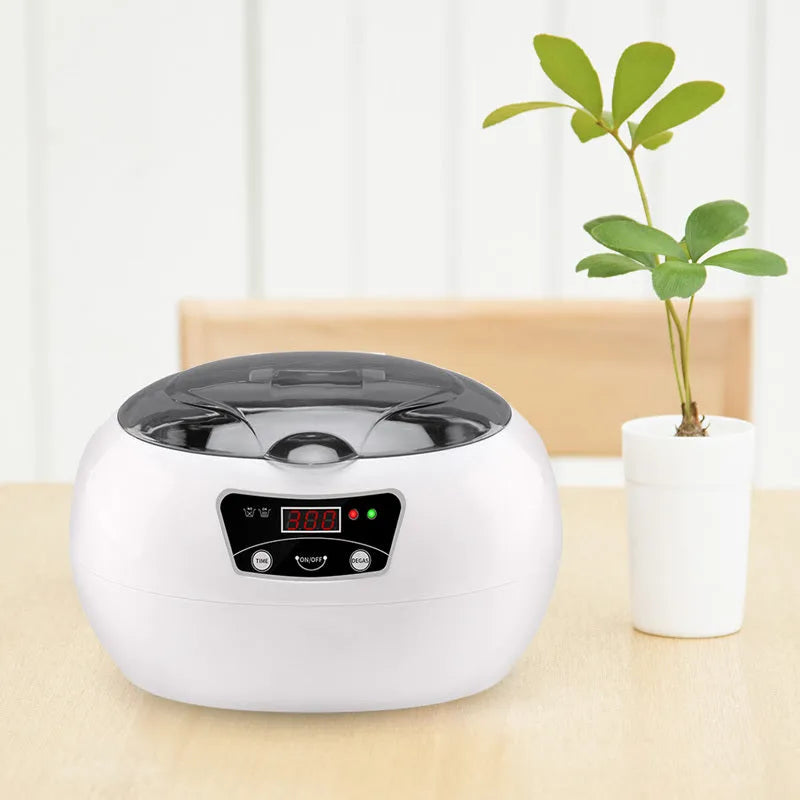 White blue ultrasonic cleaning machine for home use, 20.6cm x 15.2cm x 13.2cm, with digital control panel on a kitchen counter