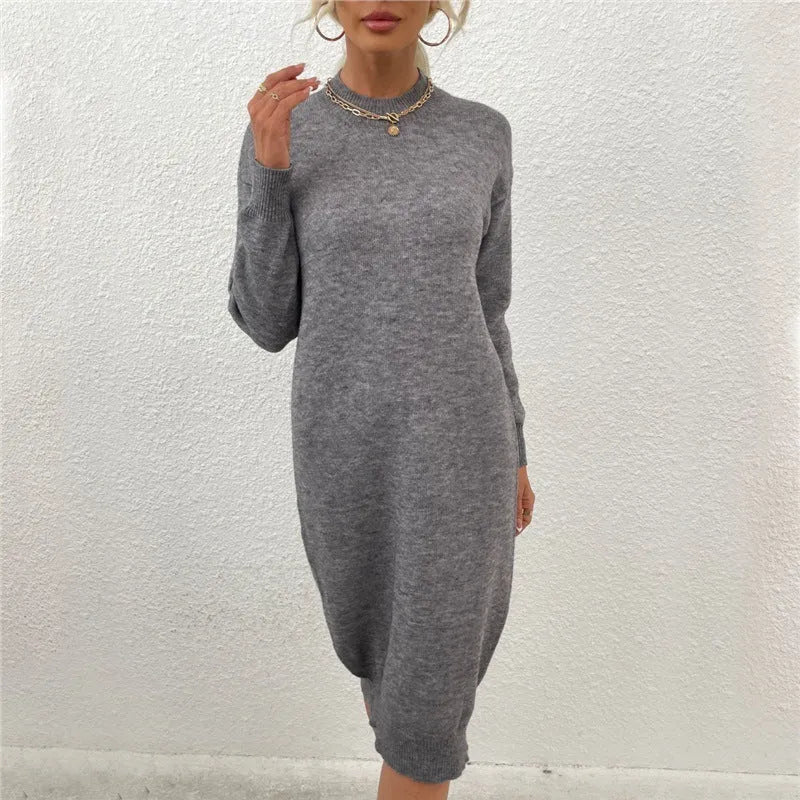 Grey women's acrylic crew neck long sleeve pullover sweater on a hanger.