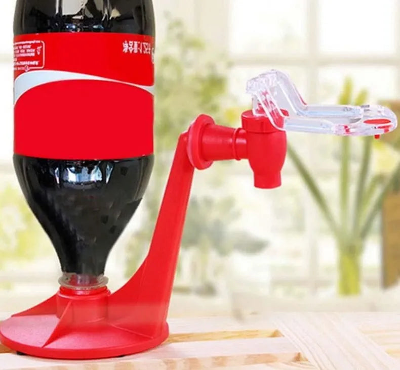 Red plastic Magic Tap soda dispenser mounted on inverted 2-litre bottle