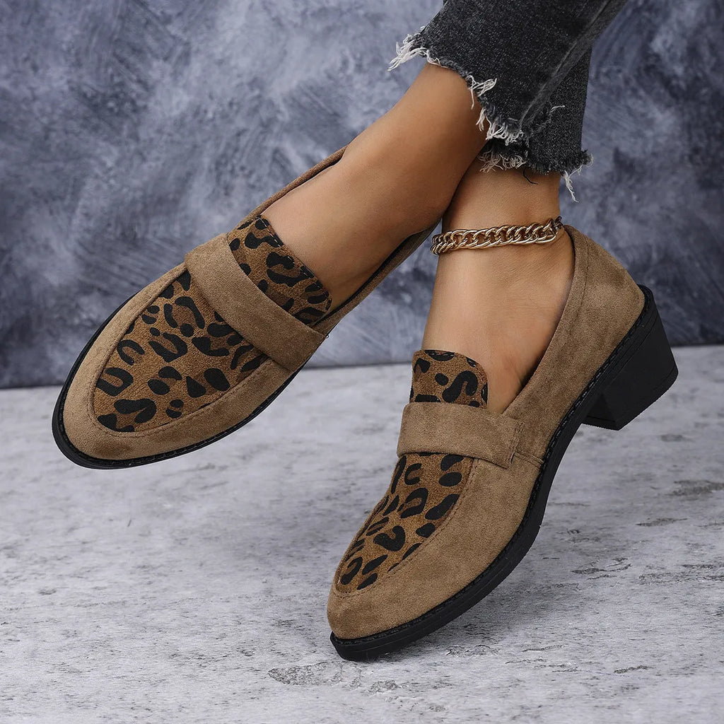 Women's brown leopard print suede slip-on shoes with chunky mid-heel and pointed toe on a white background.