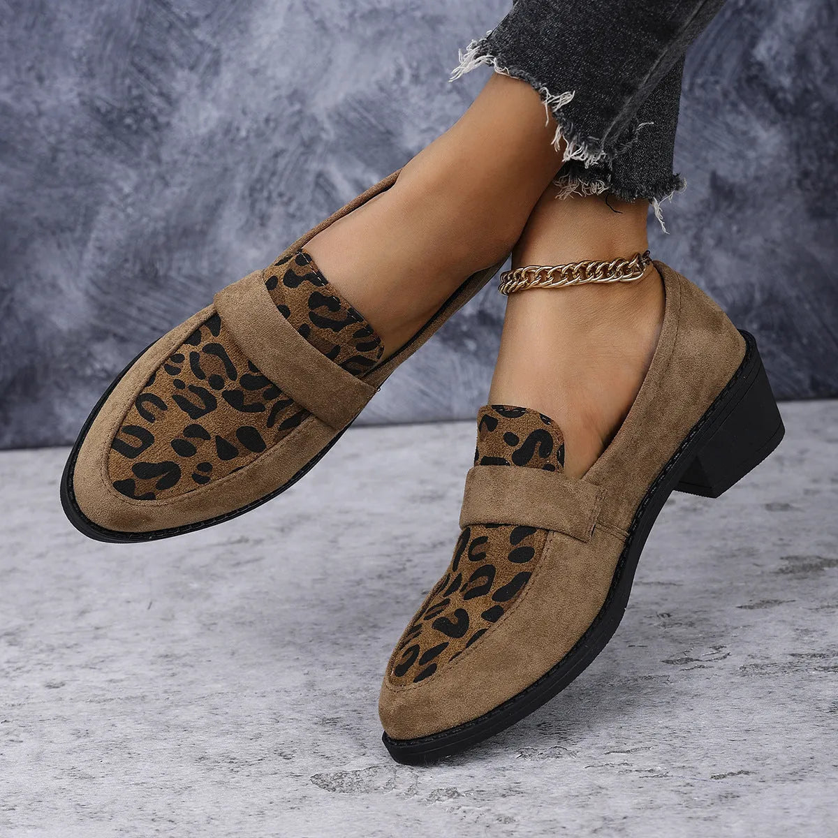 Women's brown leopard print suede slip-on shoes with chunky mid-heel and pointed toe on a white background.