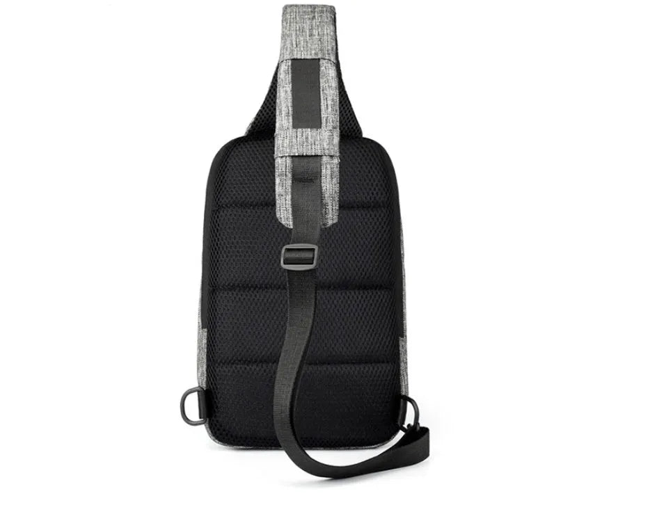 Small dark blue waterproof oxford cloth chest bag showing front zipper closure and strap