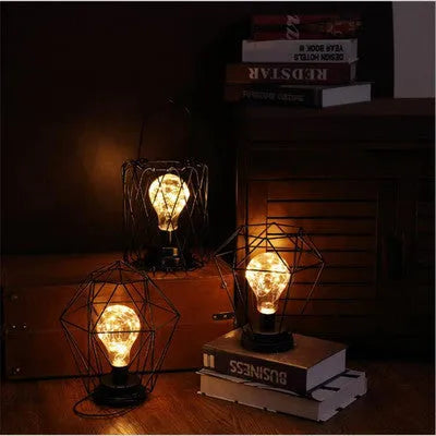 Iron hollow table lamp in red wine glass design with warm white LED lighting