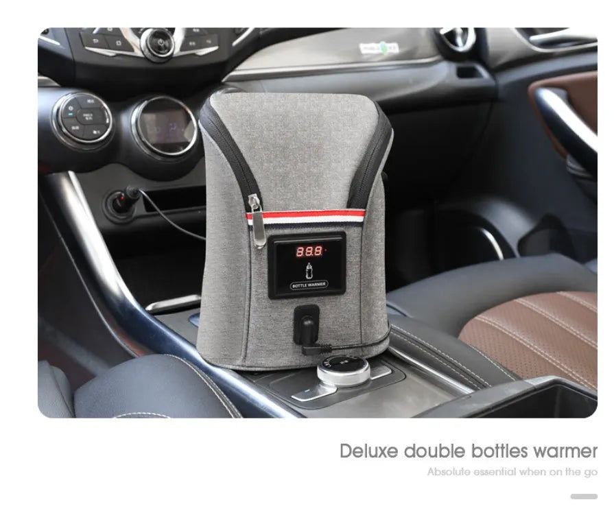 Grey Oxford cloth portable car USB baby bottle warmer showing electronic temperature display and hanging buckle.