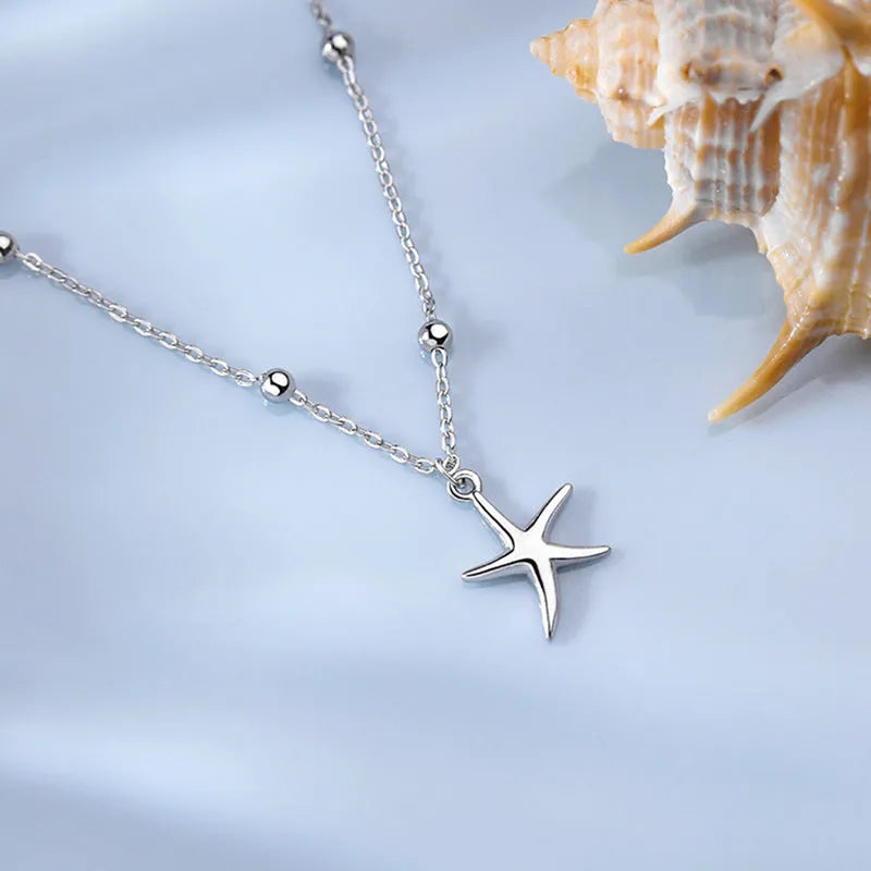 S925 sterling silver anklet with a starfish charm and adjustable beaded chain.