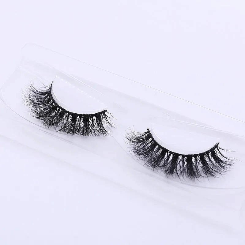 Handmade 3D mink full strip false eyelashes in style A01 against a white background