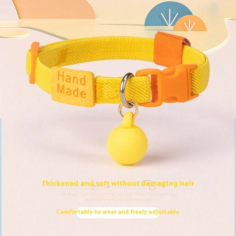 Elastic polyester decorative dog collar for small breeds, adjustable from 22cm to 32cm, shown in a monochrome colour.