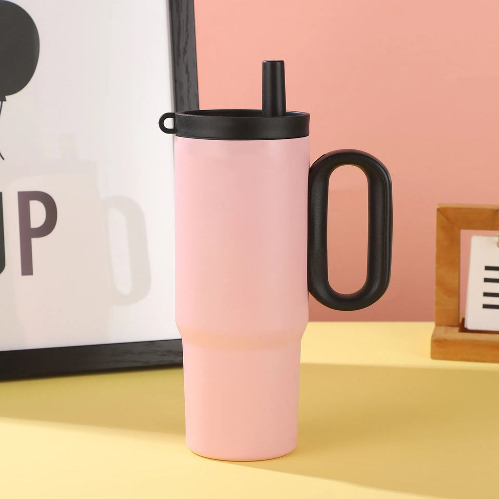 Portable insulated drink cup with carry handle and straw lid in multiple colours