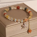 Single circle bracelet with natural coloured hair crystal beads in Korean style flower and insect designs