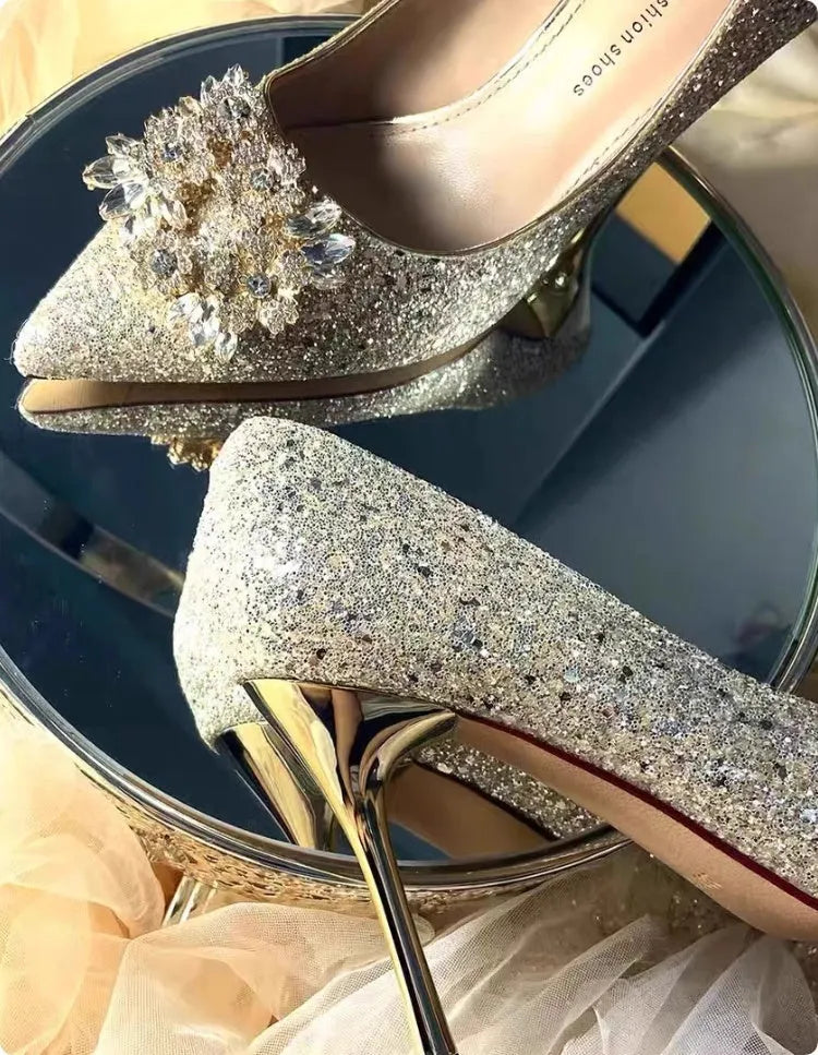 Champagne coloured bridal shoes with crystal rhinestones, pointed toe, and court heel.