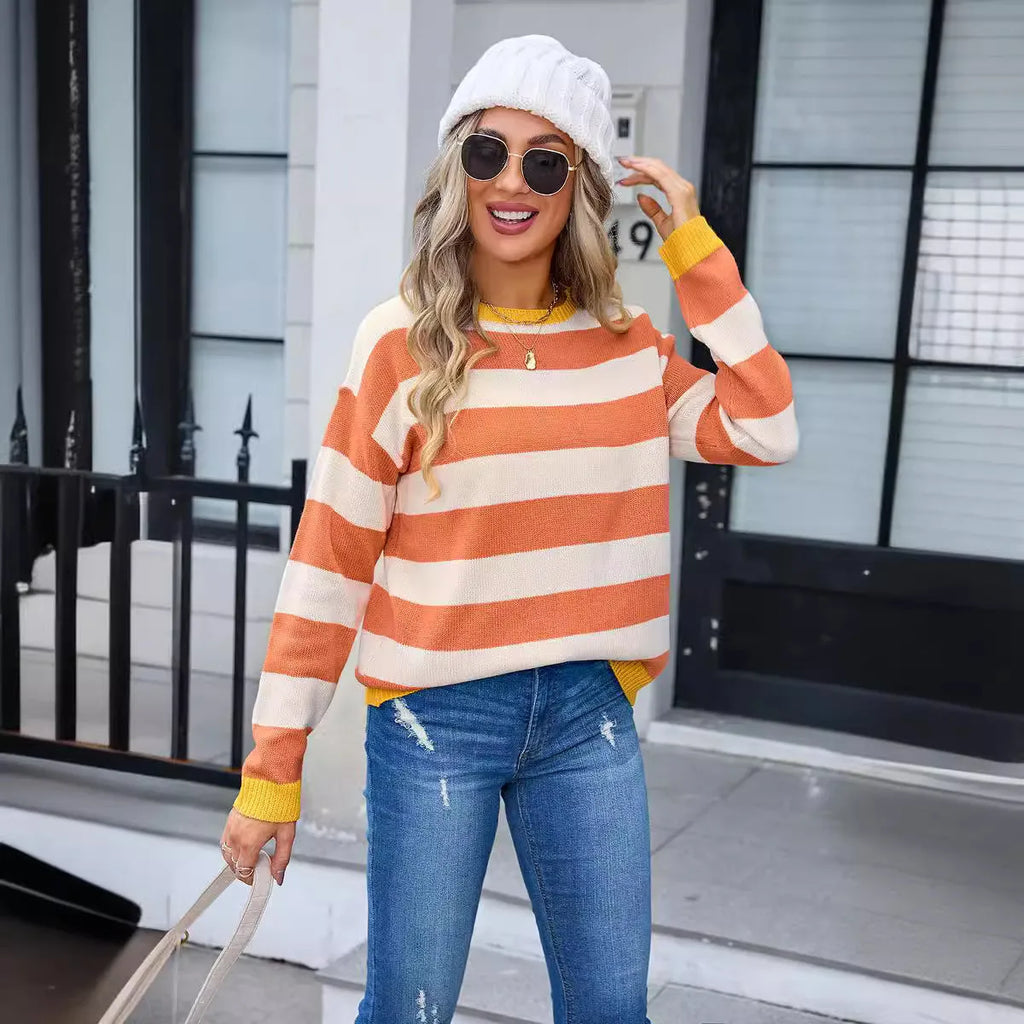 Women's loose fit long sleeve acrylic sweater in a striped pattern, shown in a blue colour.