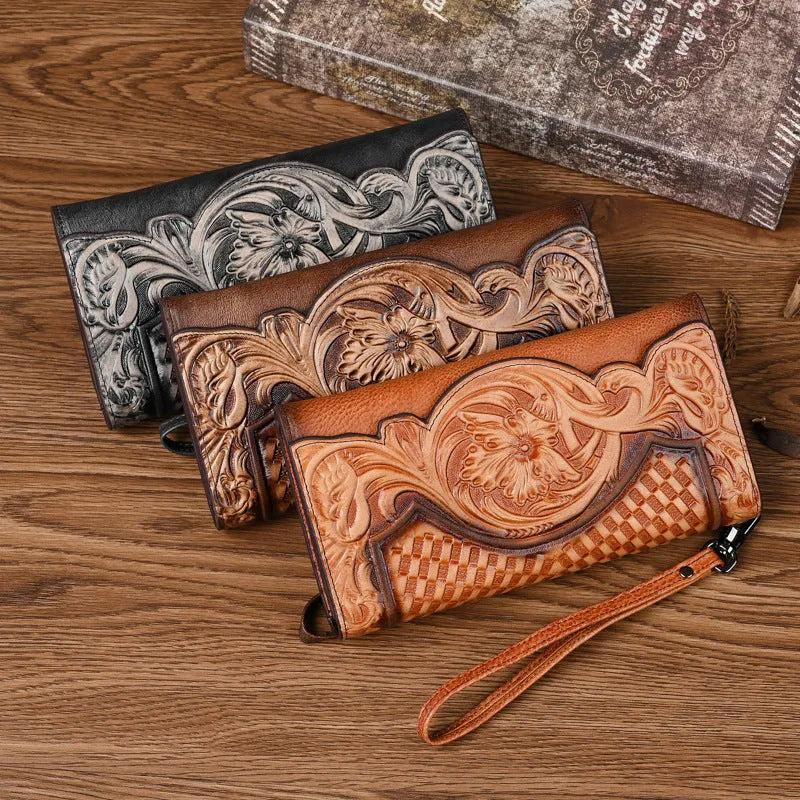 Brown genuine leather tri-fold wallet with embossed floral pattern showing interior compartments