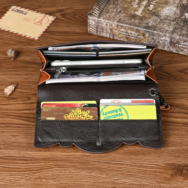 Brown genuine leather tri-fold wallet with embossed floral pattern showing interior compartments