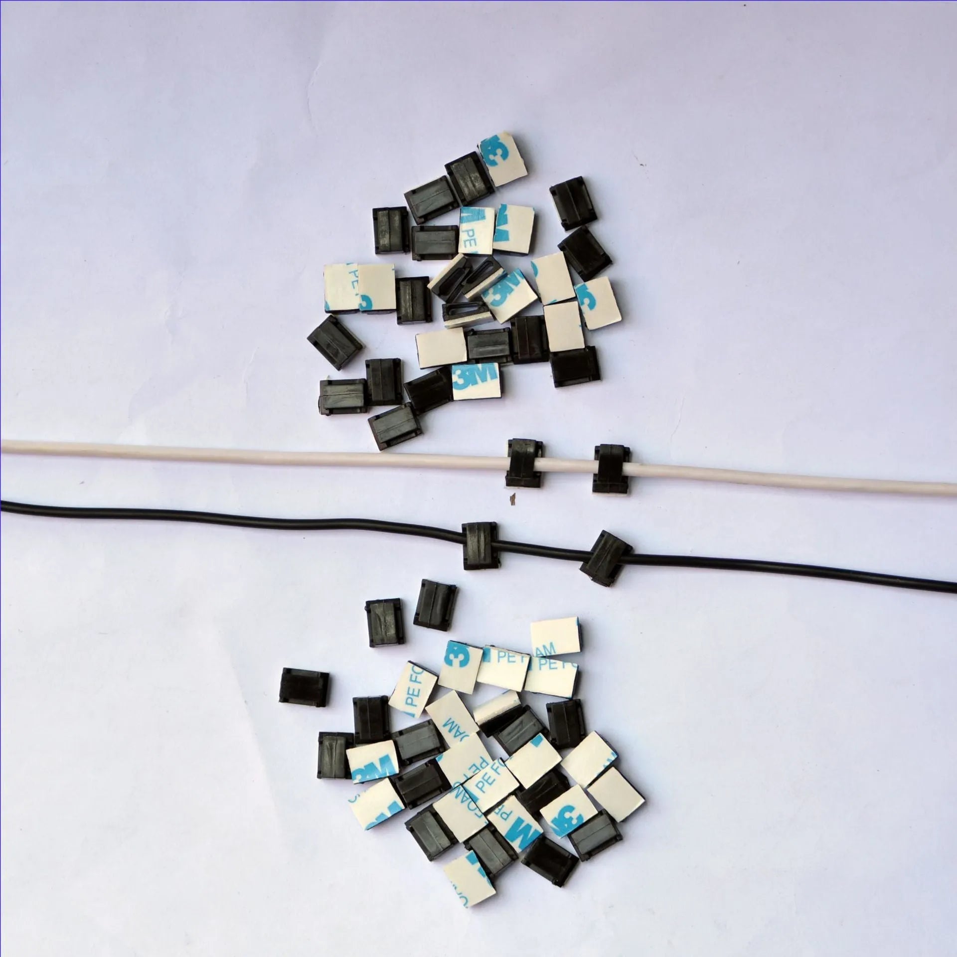 Black PA66 automotive wire clip for cable management measuring 9x12mm