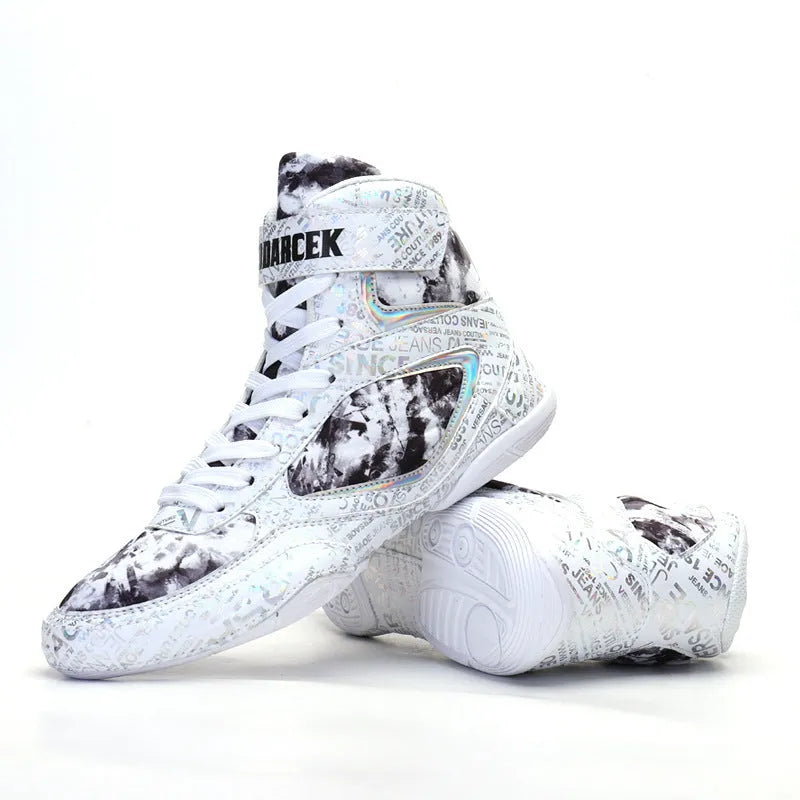 High-top boxing shoes in solid colour graffiti style with mesh upper and rubber sole on ground surface