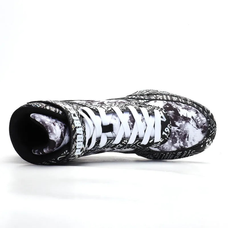 High-top boxing shoes in solid colour graffiti style with mesh upper and rubber sole on ground surface