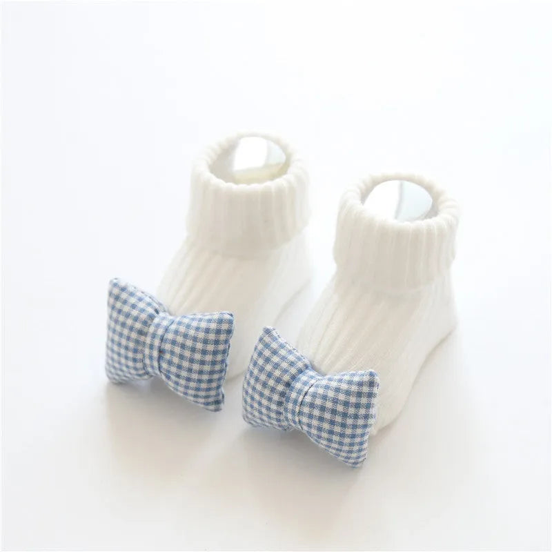 Cotton baby floor socks in multiple patterns including blue bow and lion designs