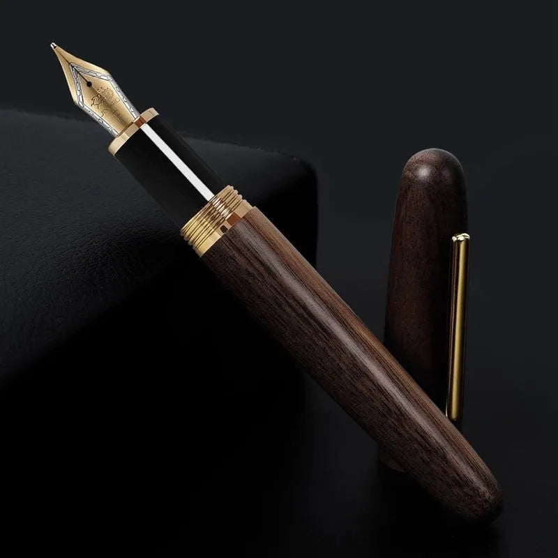 Wooden fountain pen with a rotating cap shown alongside nib options on a desk.