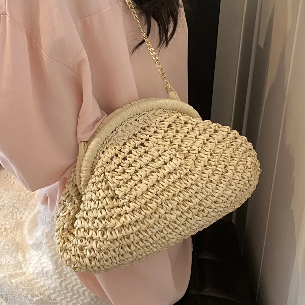 Shell-shaped straw shoulder bag with chain trim in khaki colour