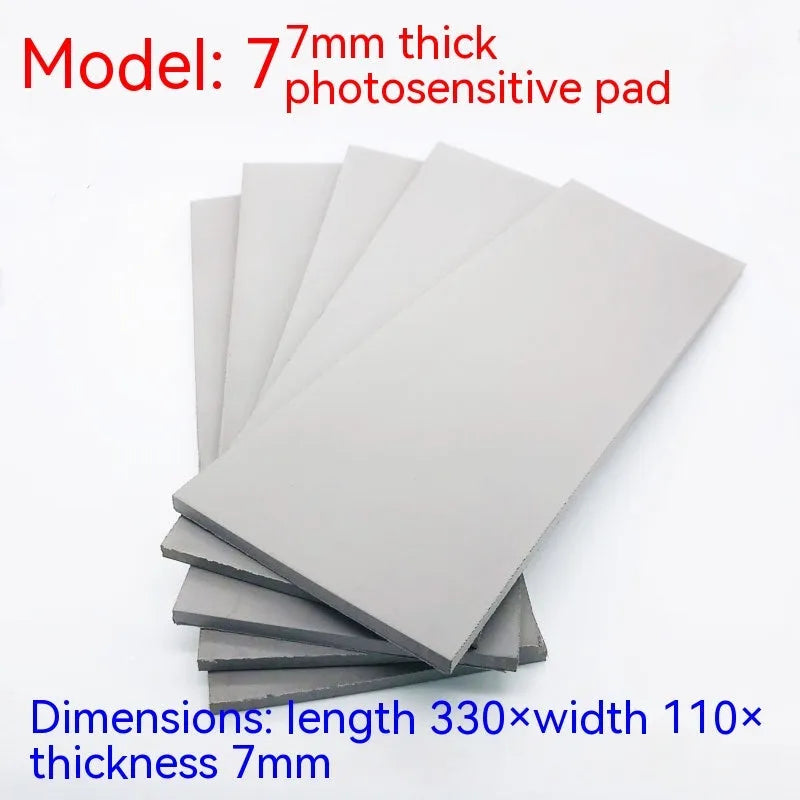 Black and grey plastic light-sensitive seal mat for pottery and calligraphy, 330mm by 110mm.