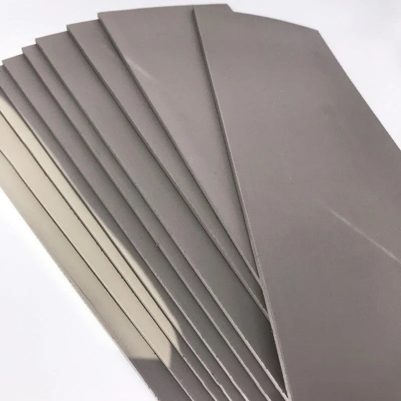 Black and grey plastic light-sensitive seal mat for pottery and calligraphy, 330mm by 110mm.