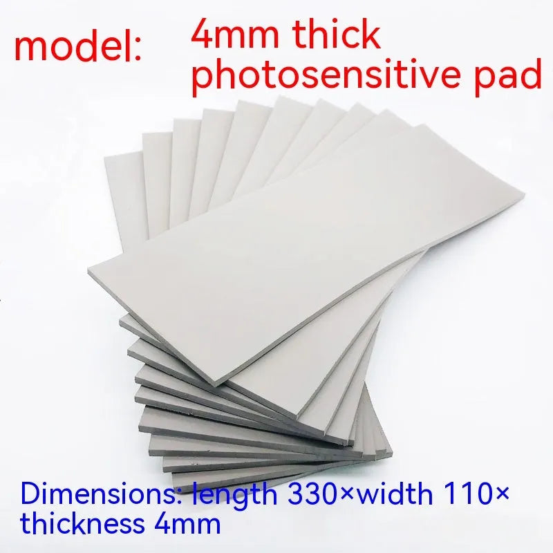 Black and grey plastic light-sensitive seal mat for pottery and calligraphy, 330mm by 110mm.