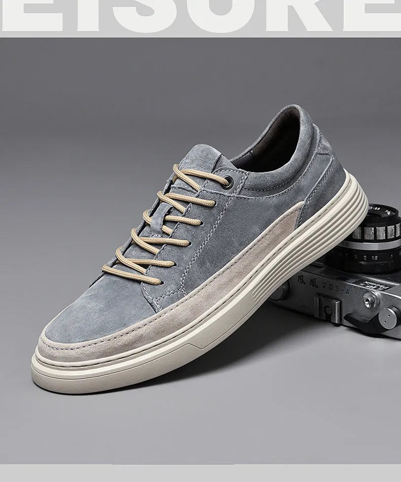 Men's grey casual leather skate shoes with lace-up front and rubber sole