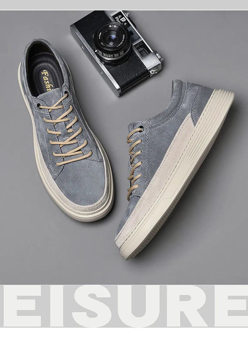 Men's grey casual leather skate shoes with lace-up front and rubber sole