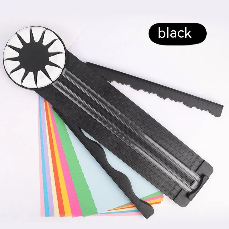 Pink and black 12-in-1 dotted plastic paper cutting machine on a white background.