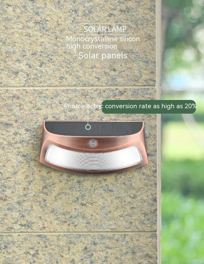 Solar powered outdoor wall lamp with smiling face design for garden and courtyard lighting