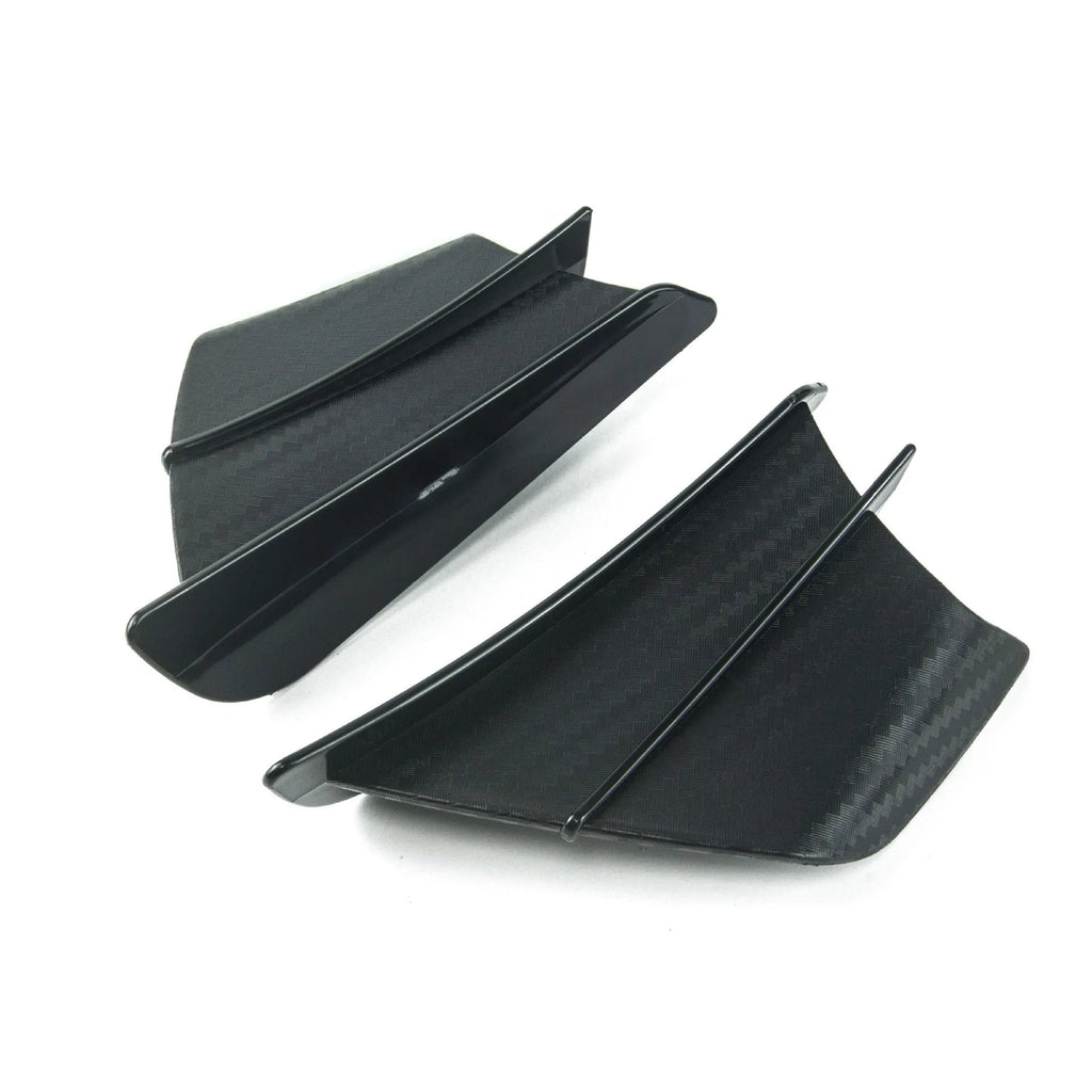 Universal motorcycle spoiler wind wings in pure black finish with glossy forged pattern, side view on a dark background.