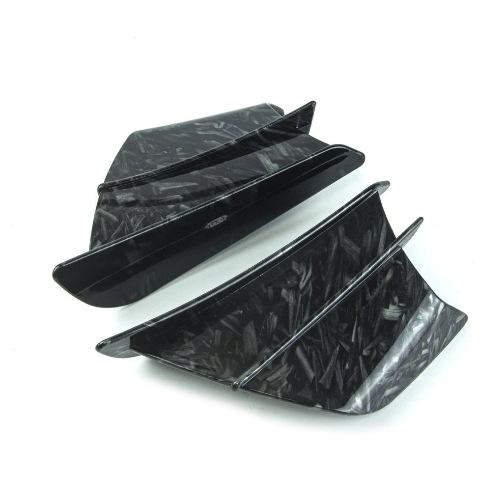 Universal motorcycle spoiler wind wings in pure black finish with glossy forged pattern, side view on a dark background.