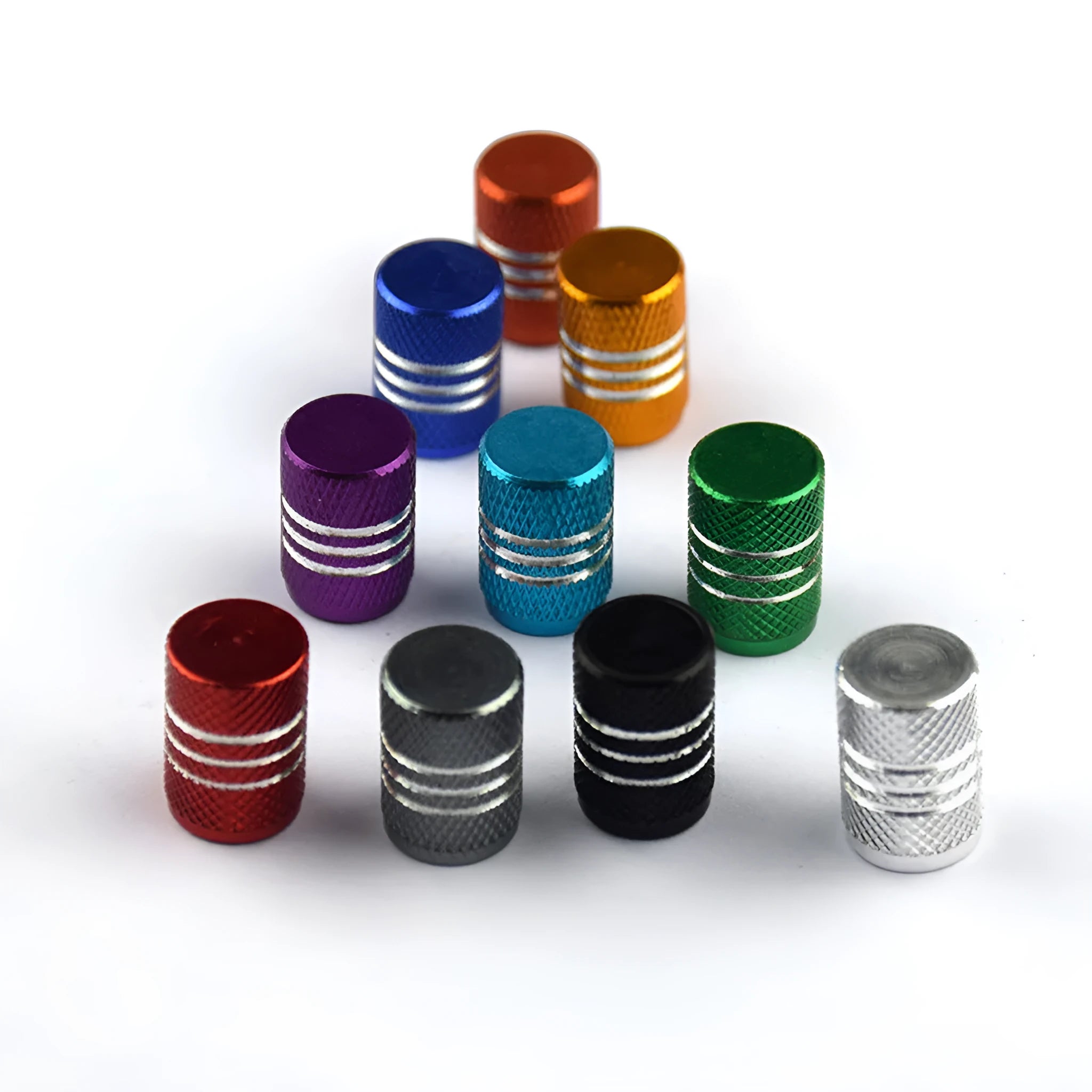 Set of coloured stainless steel car tyre valve caps in ten colours on a white background