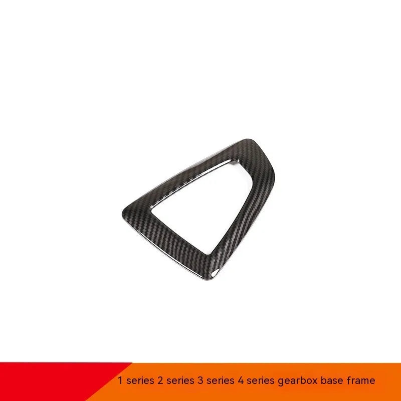 BMW gear base frame in carbon fibre pattern with titanium finish, 13x9cm, left-side fitment