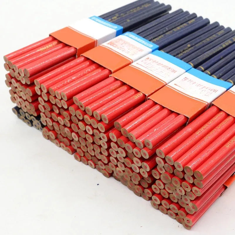 Ten red and blue round wooden carpenter pencils for marking, laid out on a work surface.
