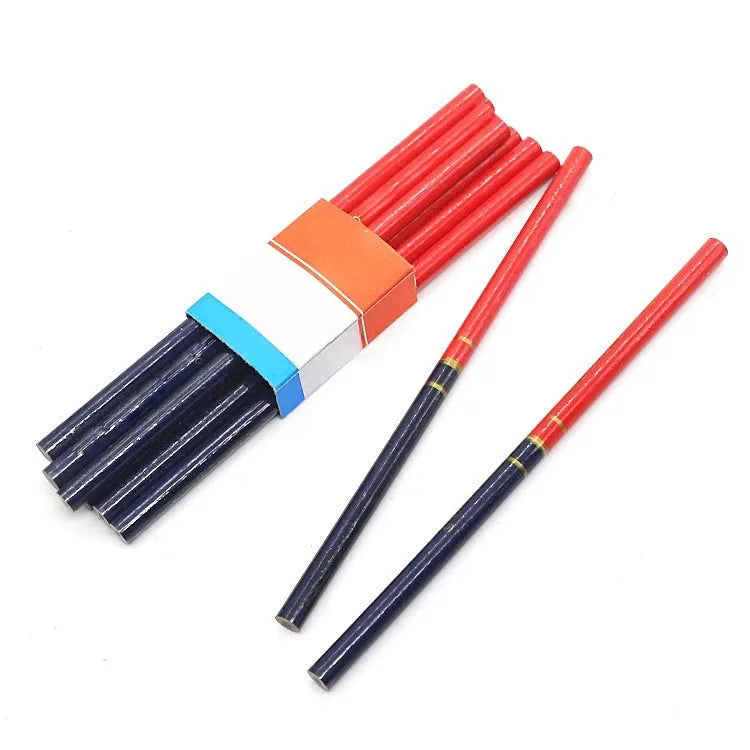 Ten red and blue round wooden carpenter pencils for marking, laid out on a work surface.
