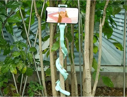 Black flexible worm arm phone holder with suction cup extended, showing 360-degree rotating bracket.
