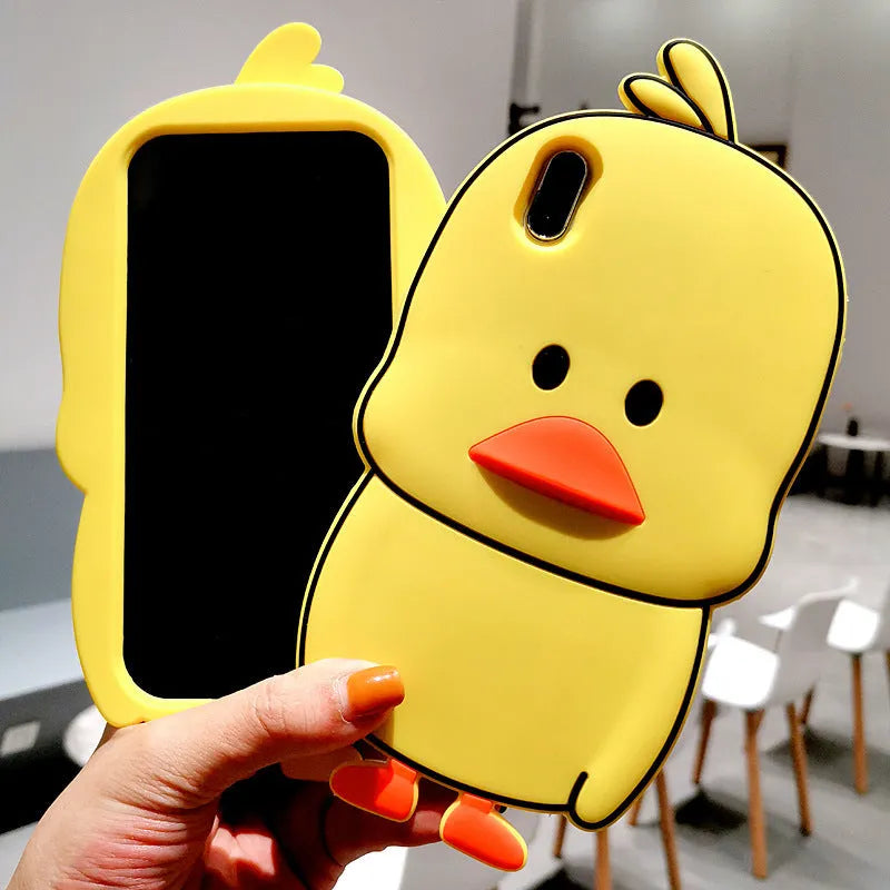 Green silicone iPhone case with a cartoon animal design on a table.