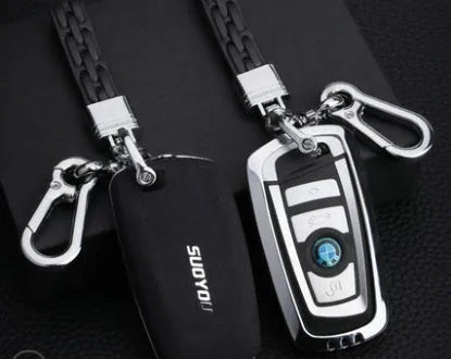 Suede key case with zinc alloy front frame in Classic Black, Charming Red, and Saddle Brown colour options